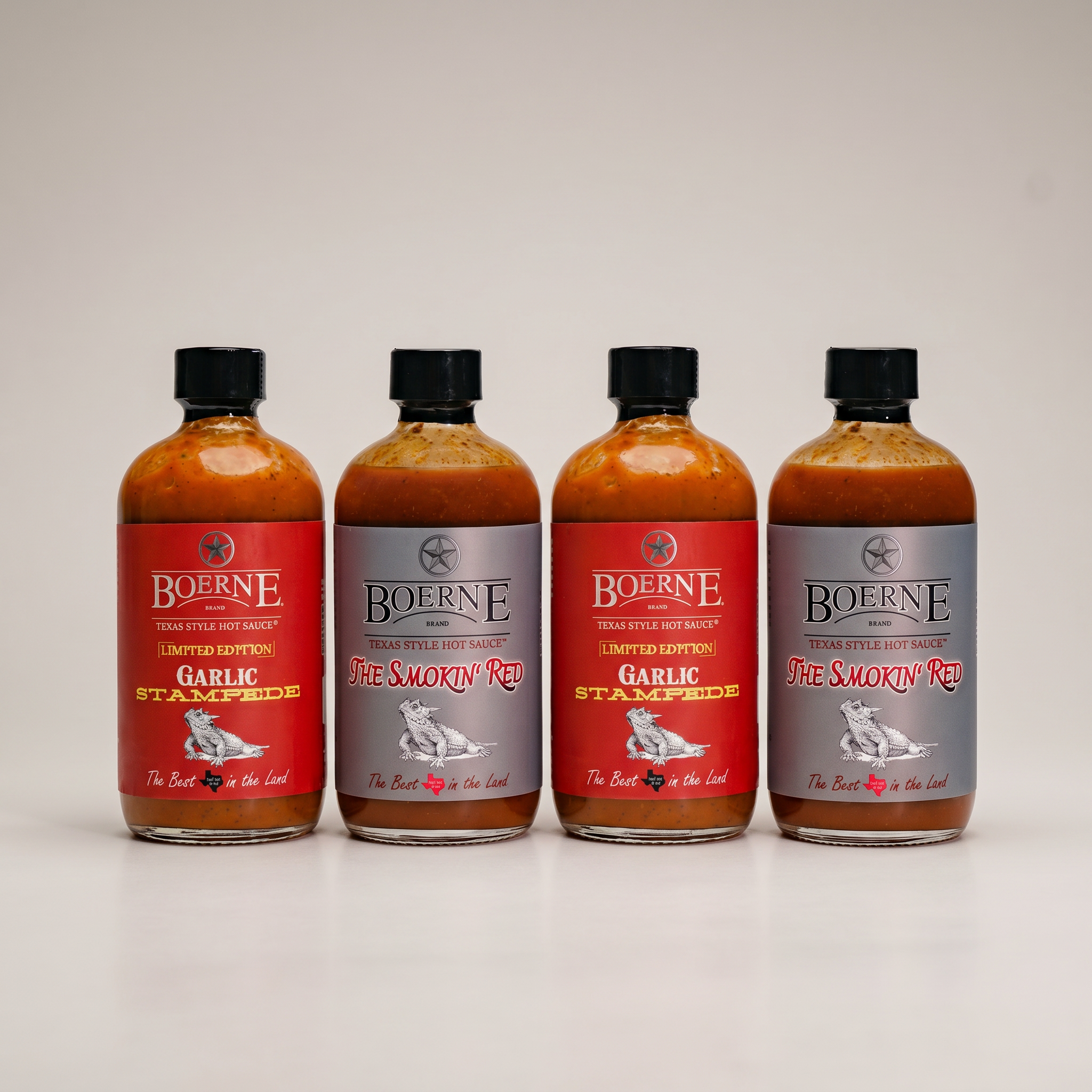 The Garlic & Smoke Box — two Garlic Stampede and two Smokin' Red 8oz bottles