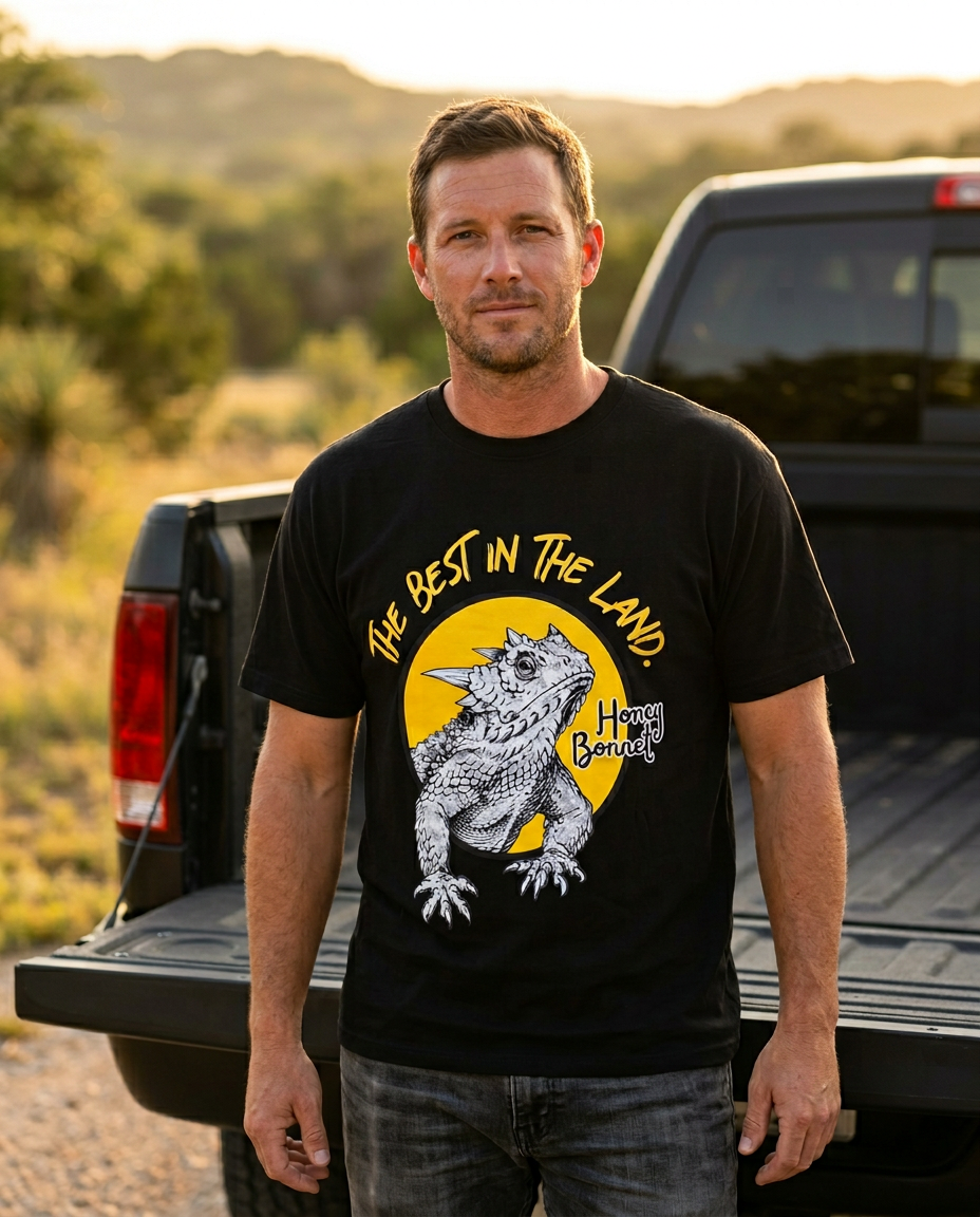 Texas model wearing the Honey Bonnet Best In The Land tee at golden hour