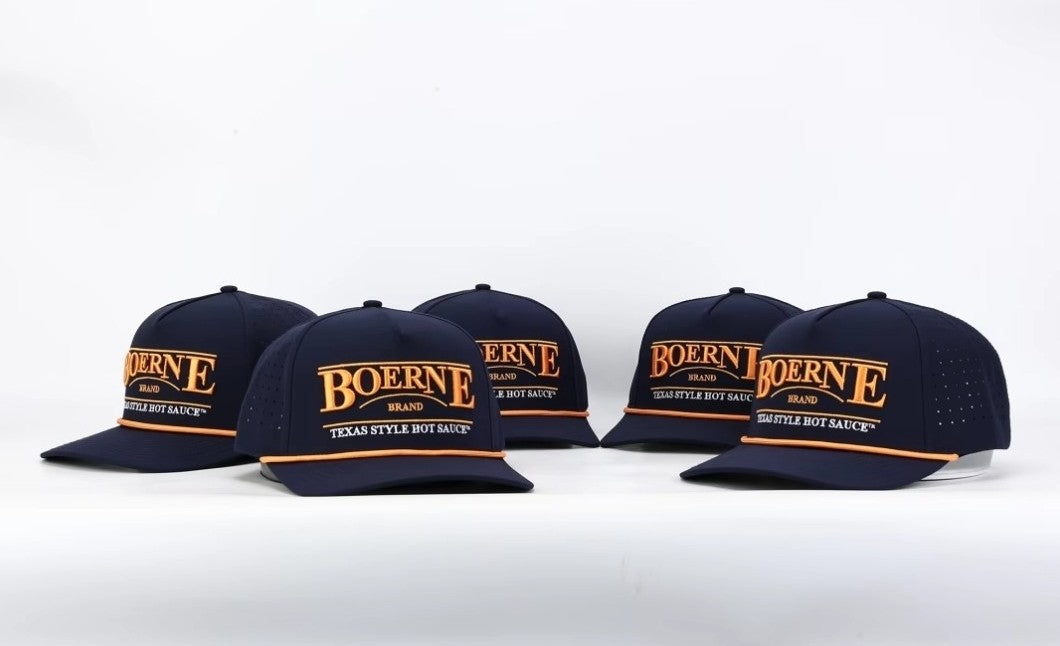 Multiple Boerne Brand Texas Style Hot Sauce navy snapback hats displayed together